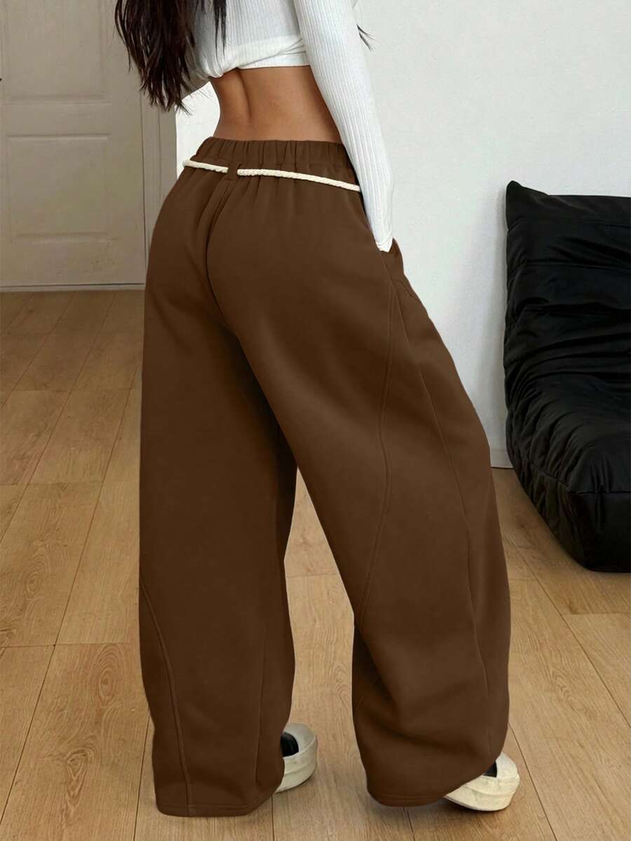 Women's casual grey plaid sweatpants featuring an elastic drawstring waistband, side pockets, and a relaxed loose fit.