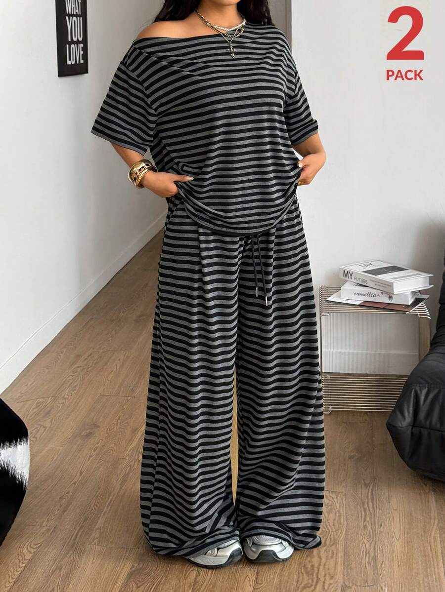 Women's casual two-piece outfit featuring a loose short-sleeve asymmetrical neck t-shirt and matching long wide leg pants with pockets.