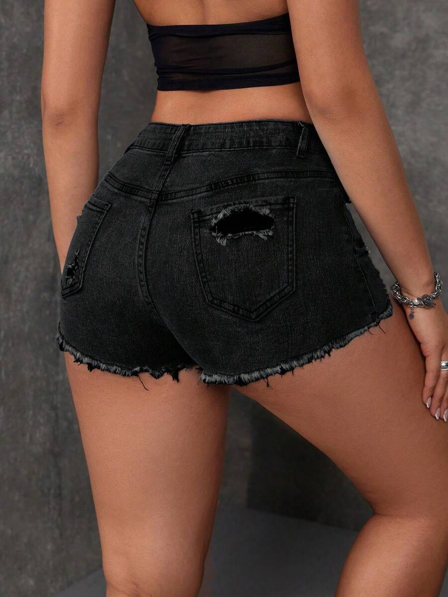 Women's solid color shorts with zipper fly, button closure, pockets, ripped details, and raw hem in a casual straight-leg short length