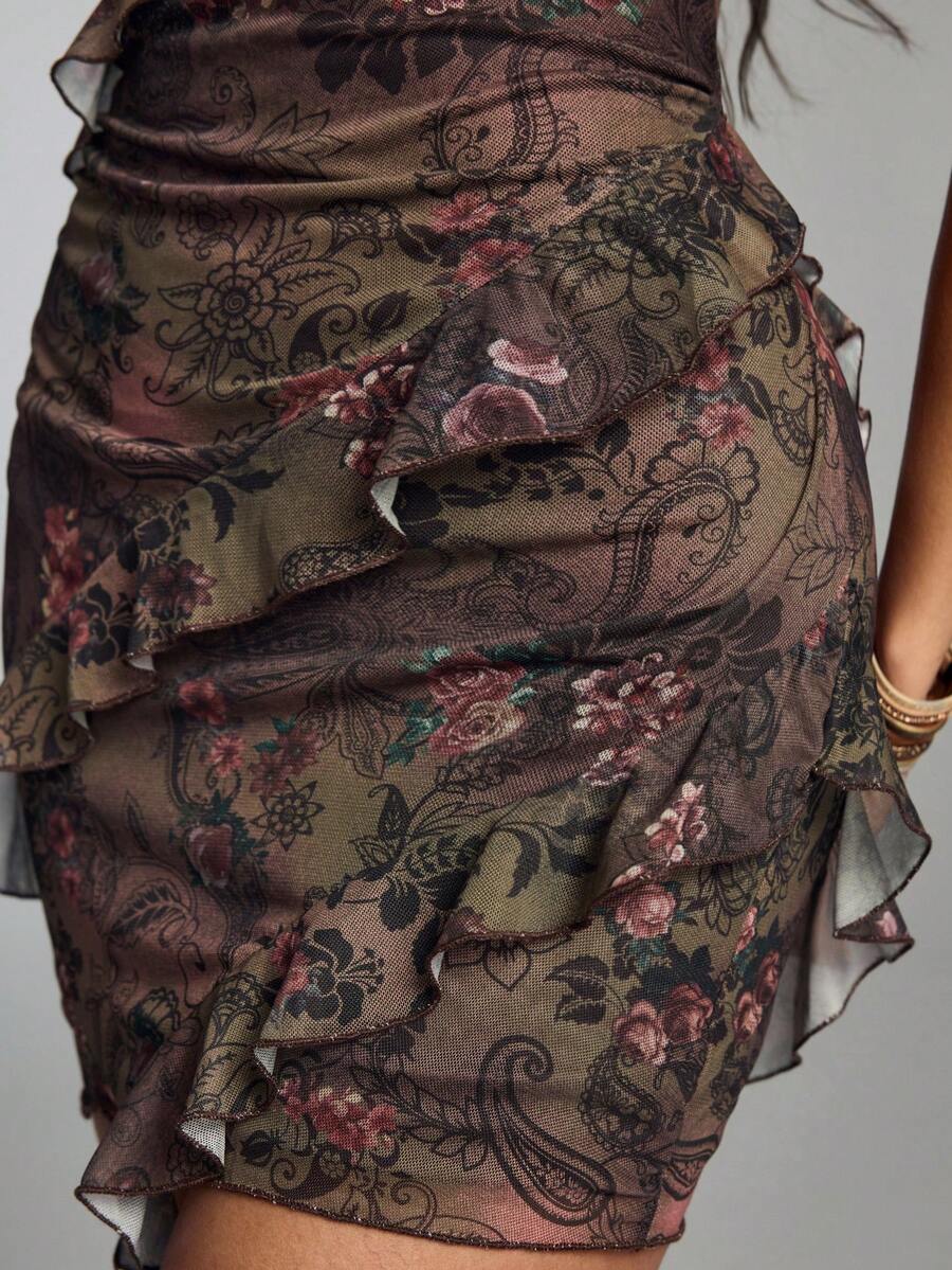 Women's brown boho halter mini dress with leopard and floral print, backless knot detail, contrast lace, slim fit, sleeveless cami style, and pencil hem.