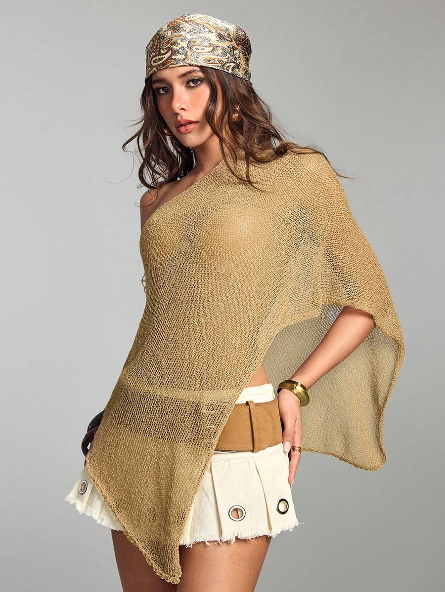 Women's casual hollow knit poncho top with boat neck, cloak sleeves, and asymmetrical hem