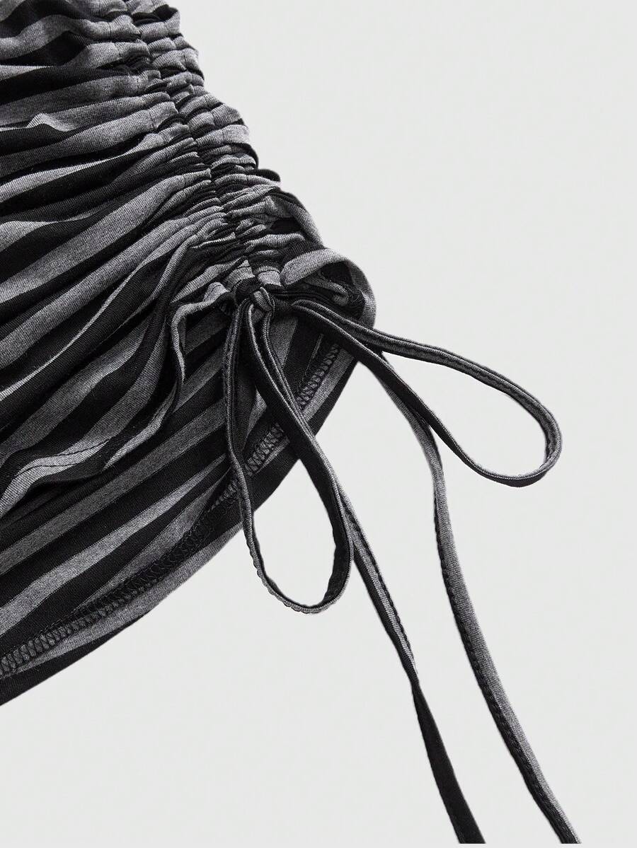 Women's black striped off-the-shoulder top with ruched drawstring knot detailing and extra-long sleeves.