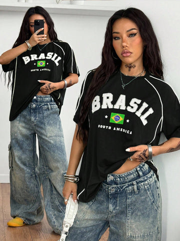 Yellow oversized graphic t-shirt featuring Brazil letter print on the front with contrast raglan sleeves and side stripe detailing.