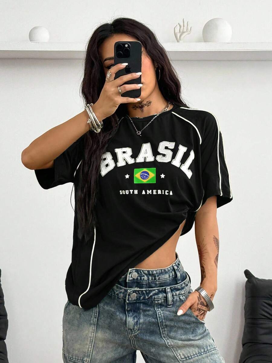 Yellow oversized graphic t-shirt featuring Brazil letter print on the front with contrast raglan sleeves and side stripe detailing.