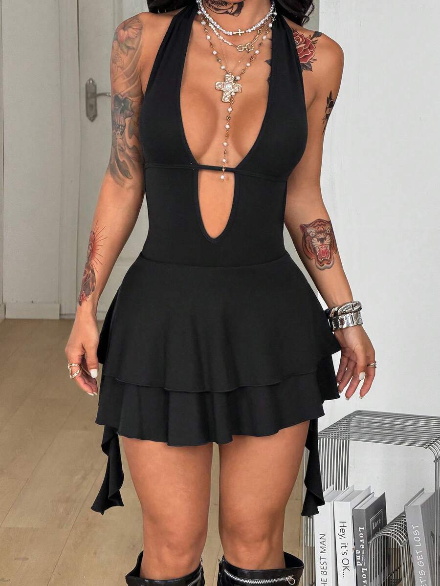 Women's sleeveless backless halter mini dress in coffee brown with a deep v-neckline, tie back detail, and a tiered A-line skirt.