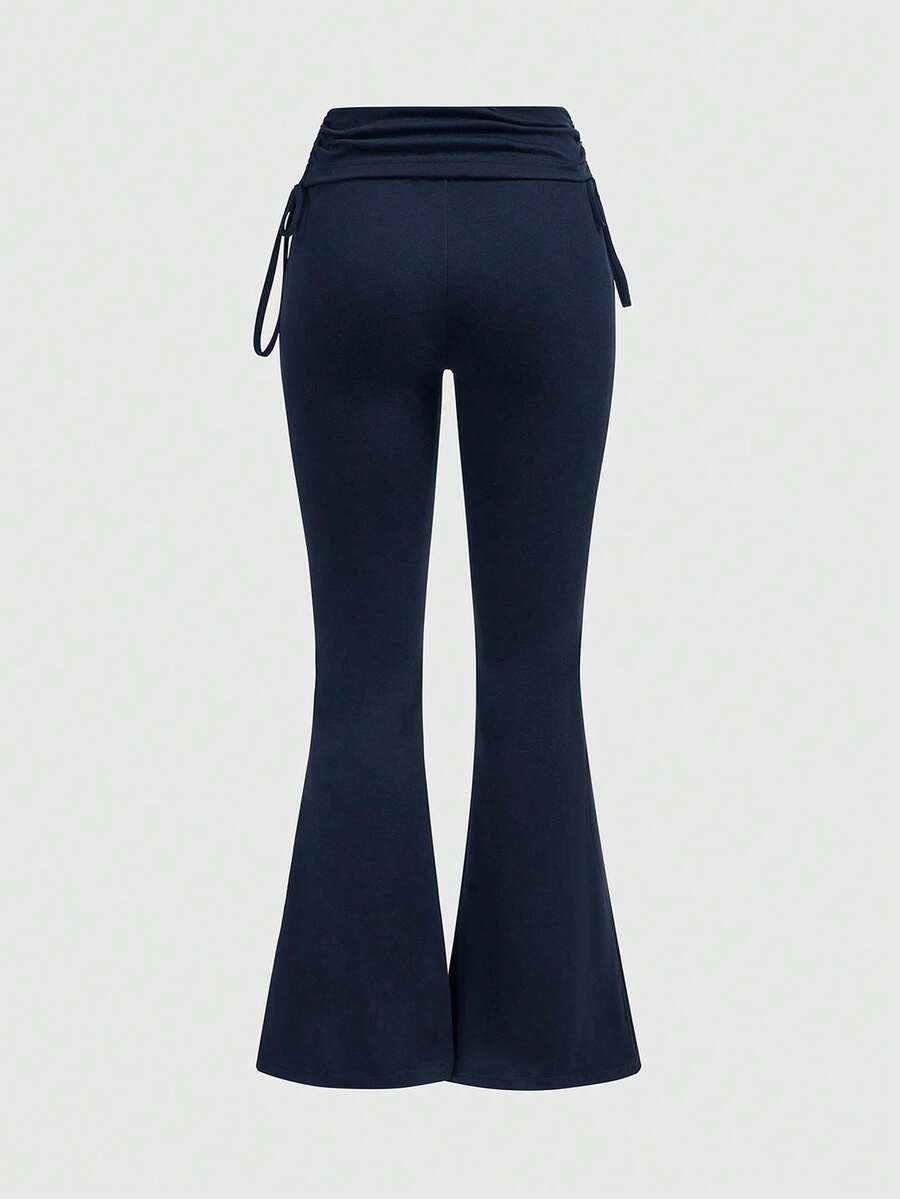 Women's low waist flare leg pants featuring an elastic drawstring waistband and ruched detail in knitted fabric.