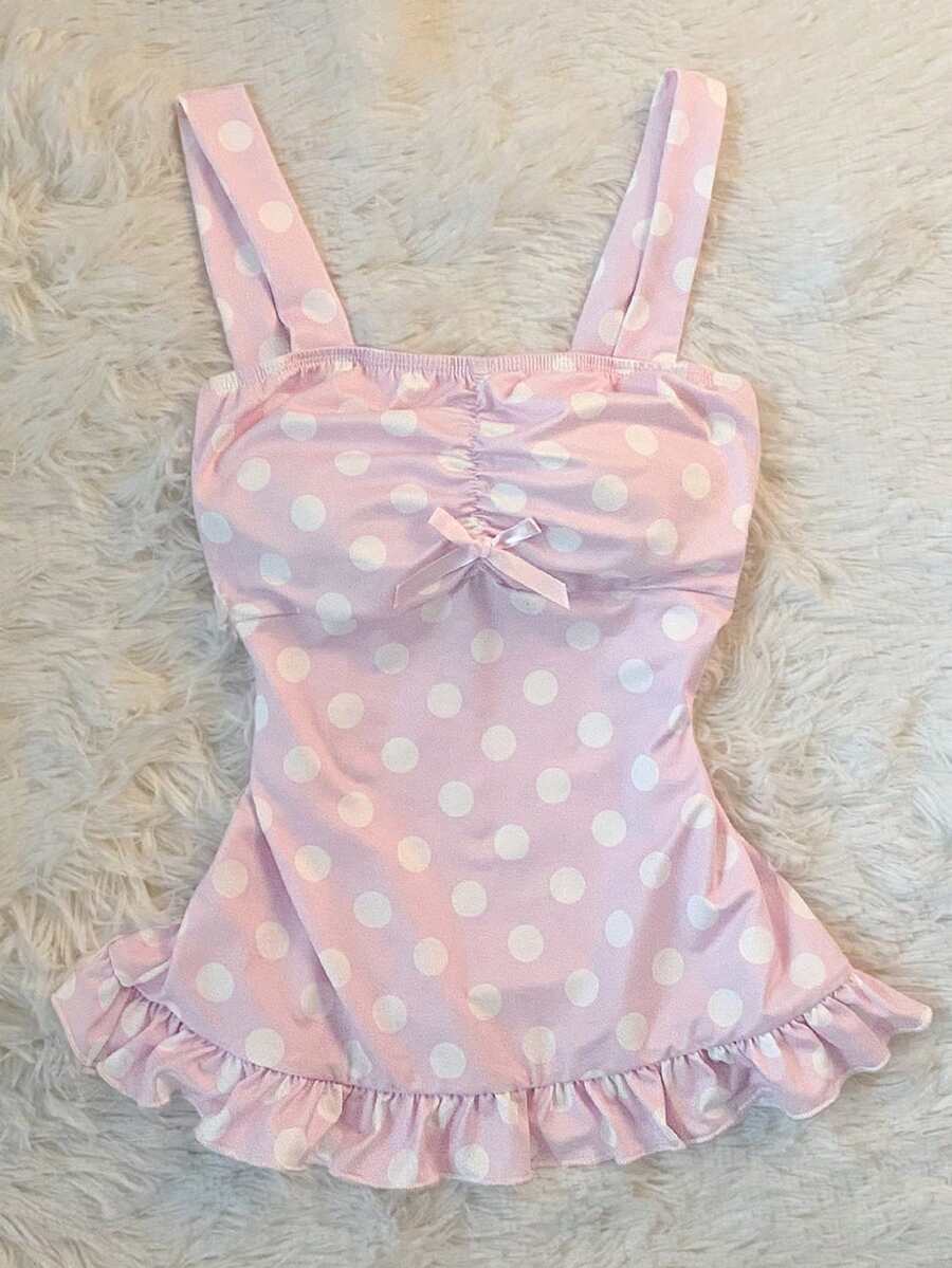 Women's retro slim-fit crop top featuring wide straps, ruched shirred detailing, asymmetrical ruffle hem, and cute bow accent.