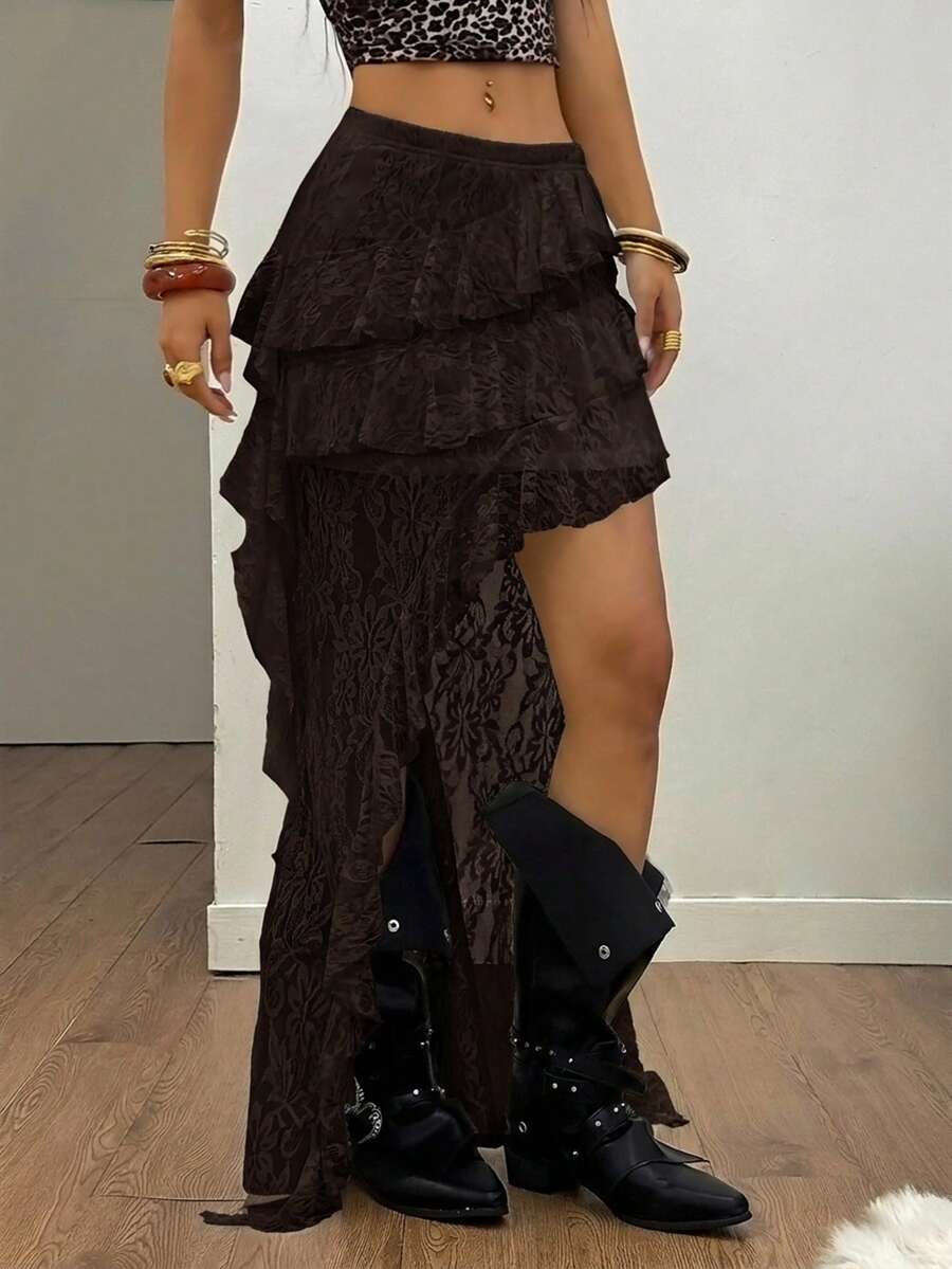 Women's low rise asymmetrical long skirt with ruffle hem detailing in semi-sheer knitted fabric.