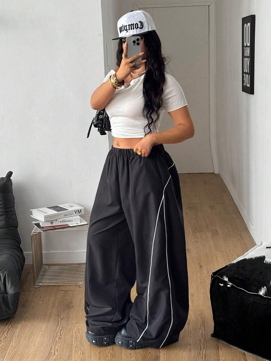 Plus size loose straight leg casual pants with elastic drawstring waist, contrast binding, and side pockets.