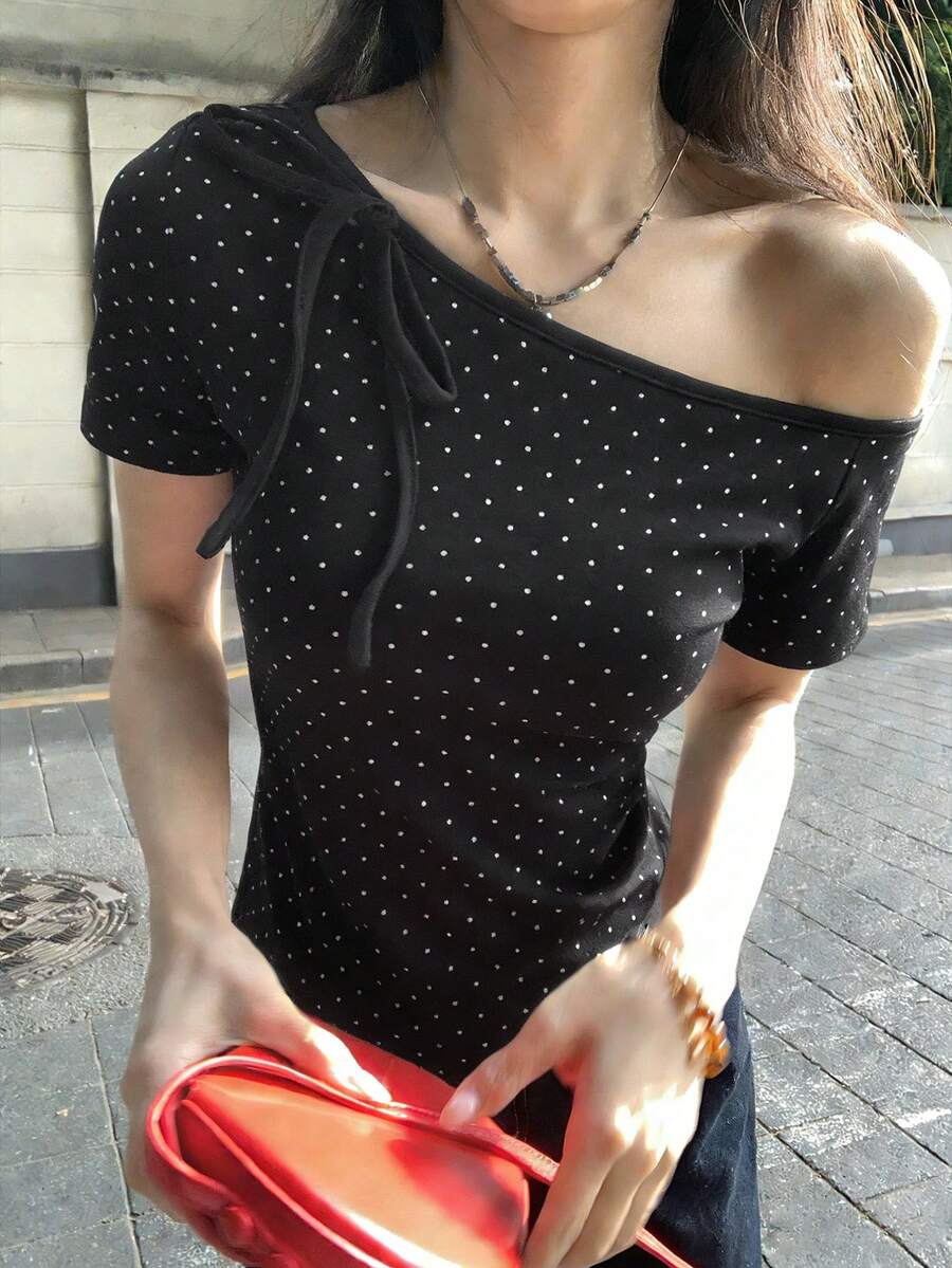 Women's casual short sleeve t-shirt with an asymmetrical neck in a loose fit knitted fabric.