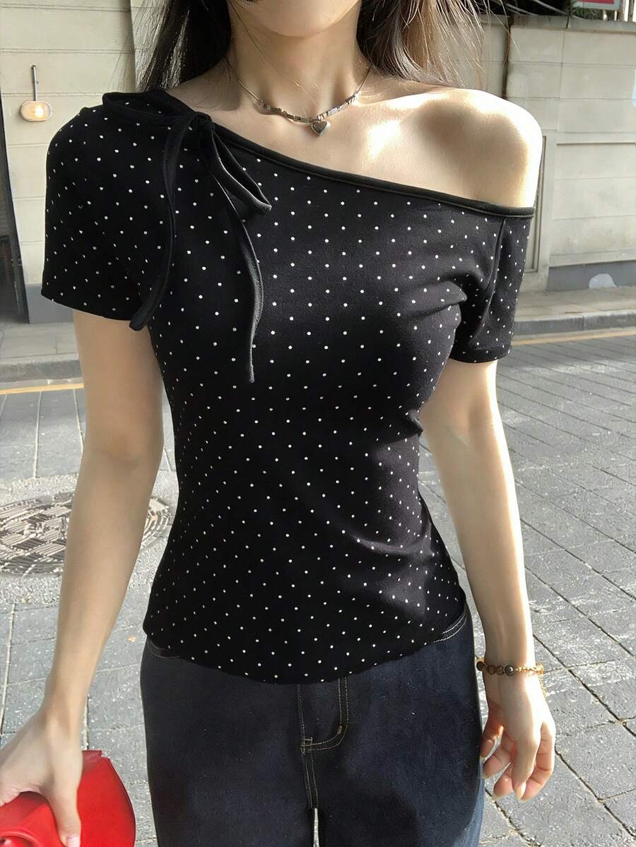 Women's casual short sleeve t-shirt with an asymmetrical neck in a loose fit knitted fabric.