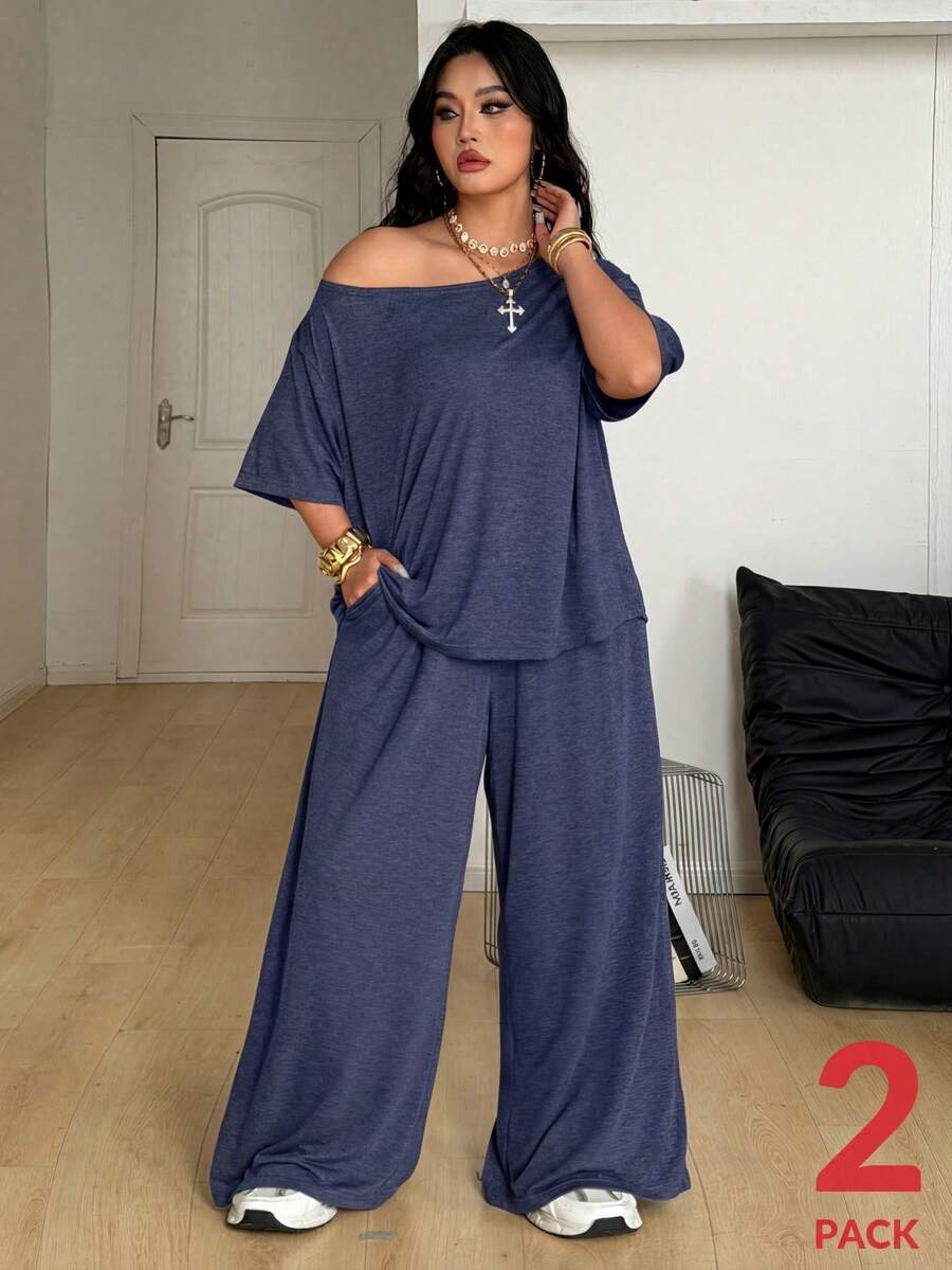 Women's casual two-piece outfit featuring a loose short-sleeve asymmetrical neck t-shirt and matching long wide leg pants with pockets.