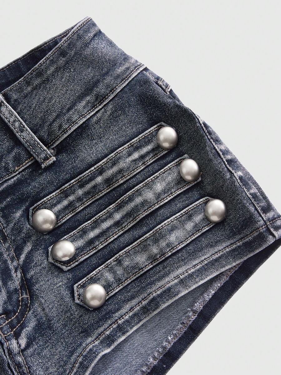 Front view of women's ultra low waist denim mini shorts with double metal button accents and zipper fly