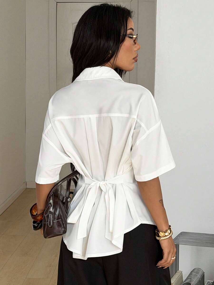 Women's casual button up shirt with half sleeves, classic shirt collar, and chest pocket in a woven fabric.