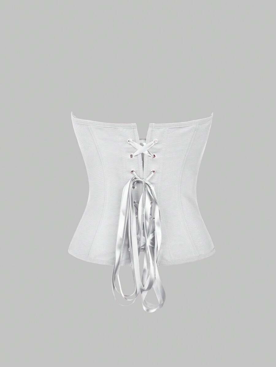Solid color strapless corset tube top featuring a backless lace-up back design and cropped slim fit.