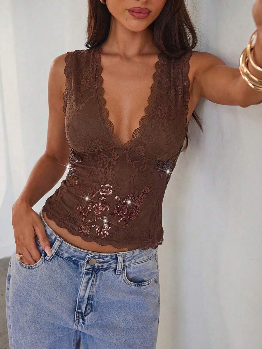 Women's sleeveless lace tank top with a V-neck, contrast lace trim, plant pattern embroidery, and a backless design.