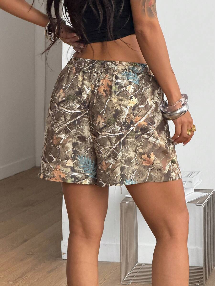 Women's casual drawstring track shorts featuring front pockets and embroidered details