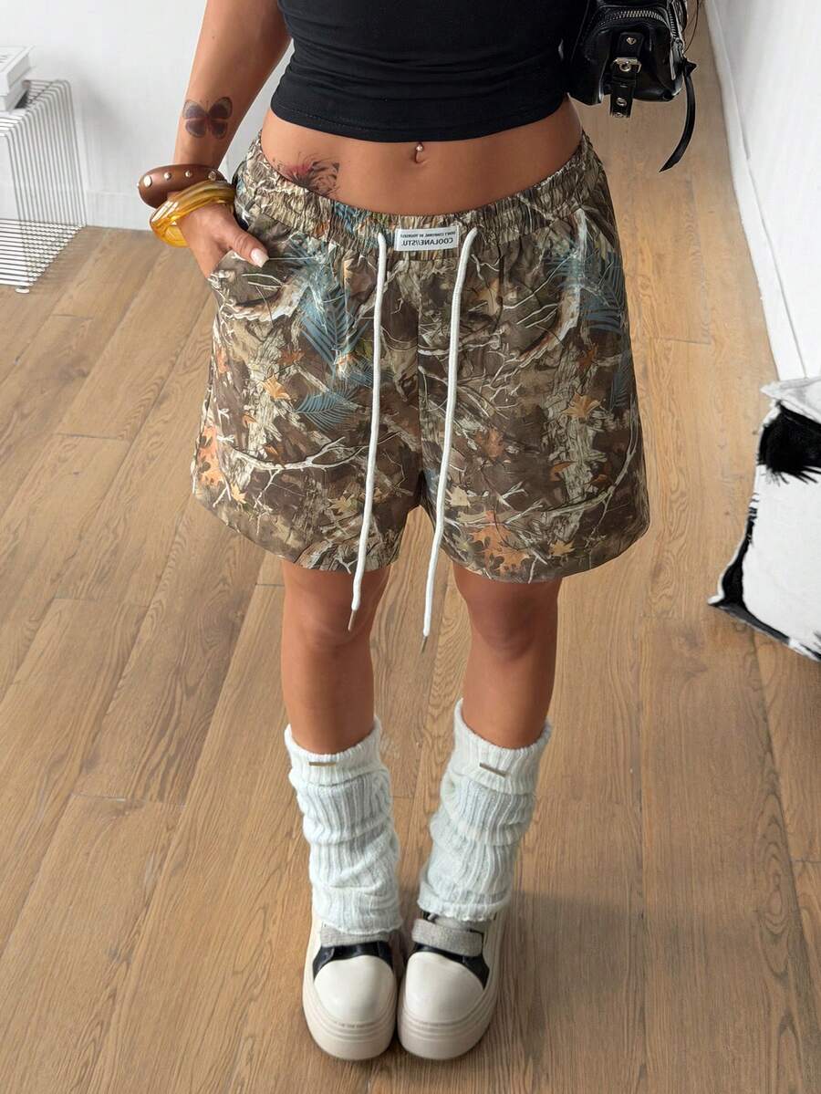 Women's casual drawstring track shorts featuring front pockets and embroidered details