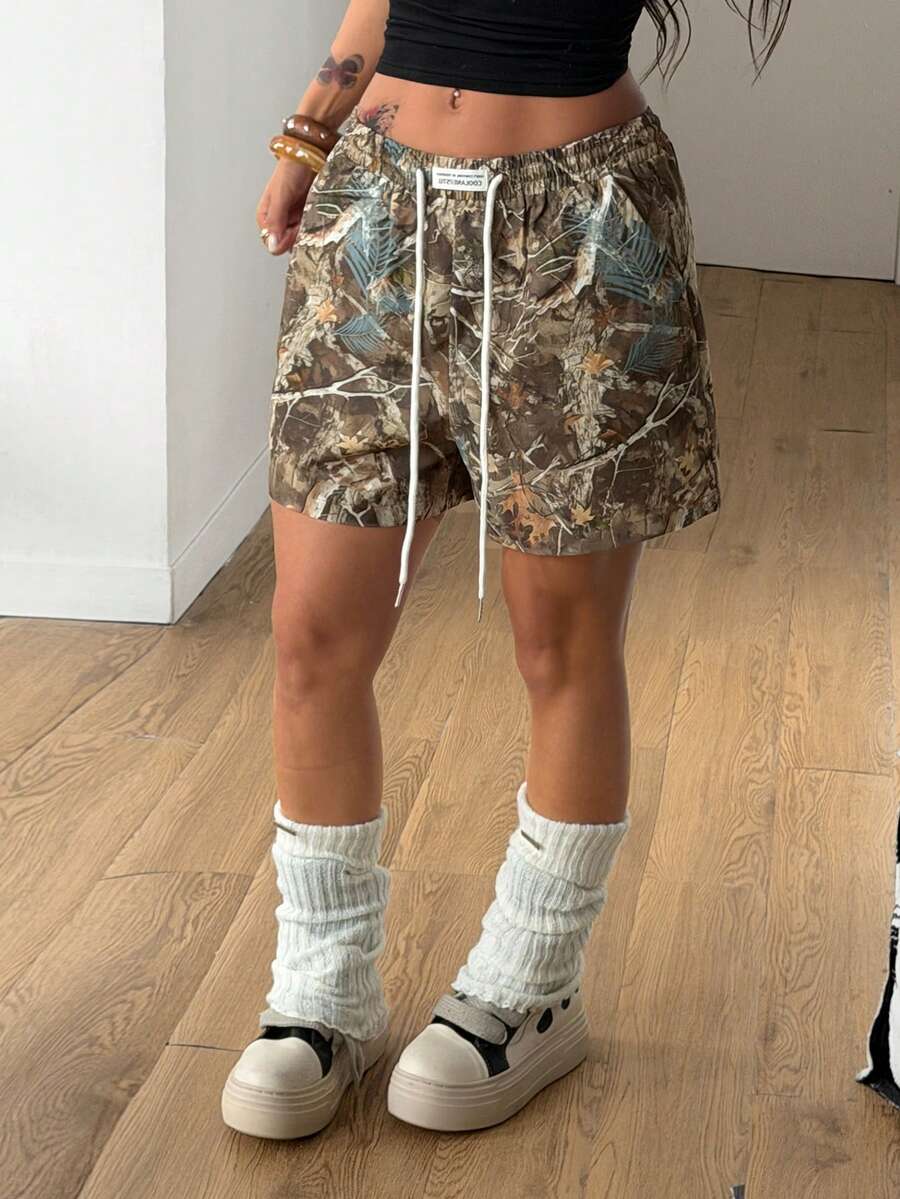 Women's casual drawstring track shorts featuring front pockets and embroidered details