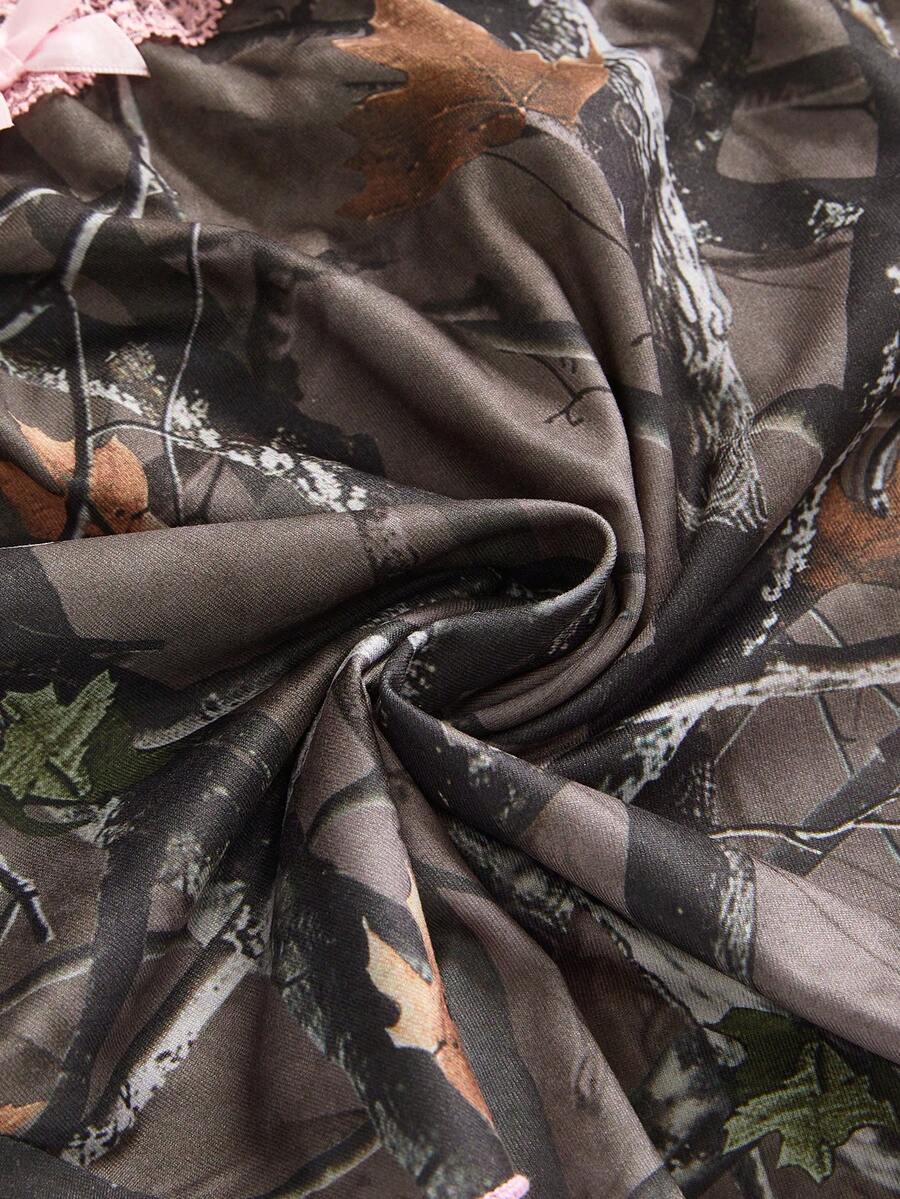 Army green Y2K plant print 2-piece set featuring a strapless boned crop top and matching low-waist ruffle hem mini skirt.