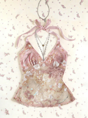 Pink sheer lace tie-up halter crop top featuring floral sequin patchwork, deep V-neck, and backless tie-back design.