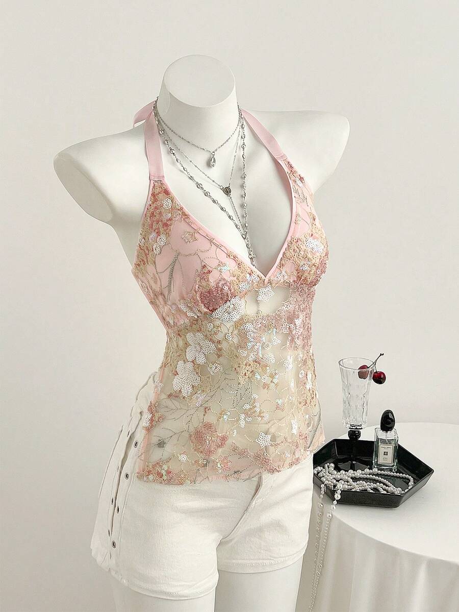 Pink sheer lace tie-up halter crop top featuring floral sequin patchwork, deep V-neck, and backless tie-back design.
