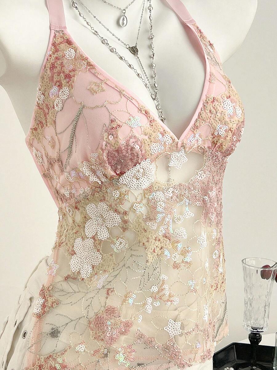 Pink sheer lace tie-up halter crop top featuring floral sequin patchwork, deep V-neck, and backless tie-back design.