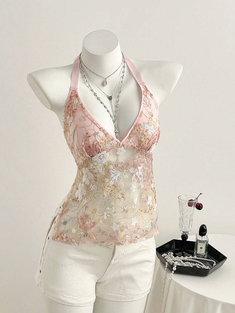 Pink sheer lace tie-up halter crop top featuring floral sequin patchwork, deep V-neck, and backless tie-back design.