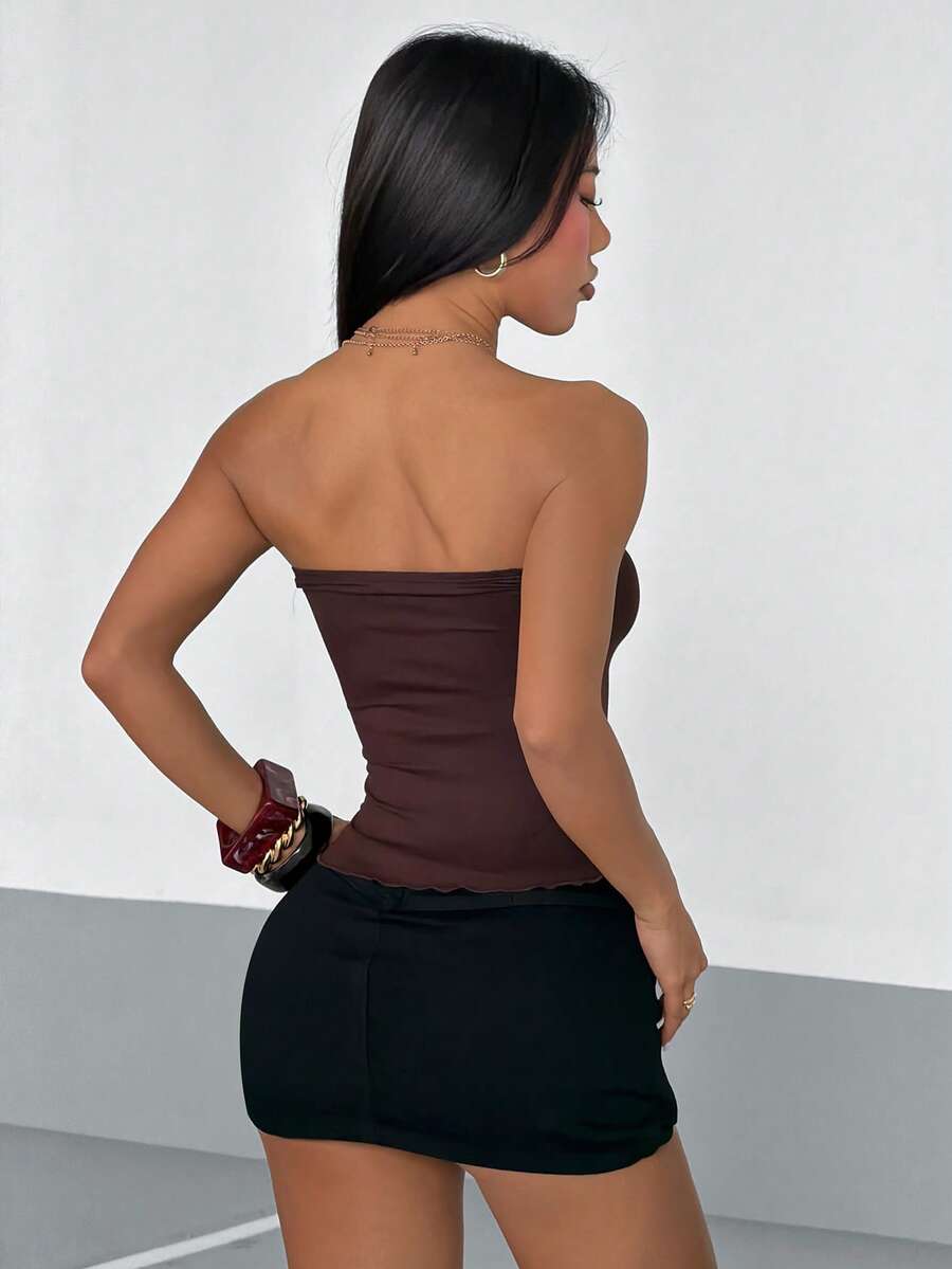 Women's brown fitted halter camisole with strapless neckline, backless design, lettuce trim, and short slim-fit silhouette.