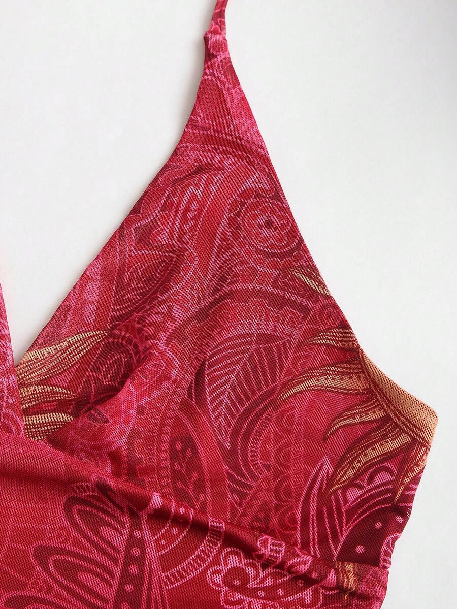 Y2K spaghetti strap sleeveless mini dress with ruched detail, backless cami styling, graphic pattern, slim fit, high waist, and asymmetrical hem