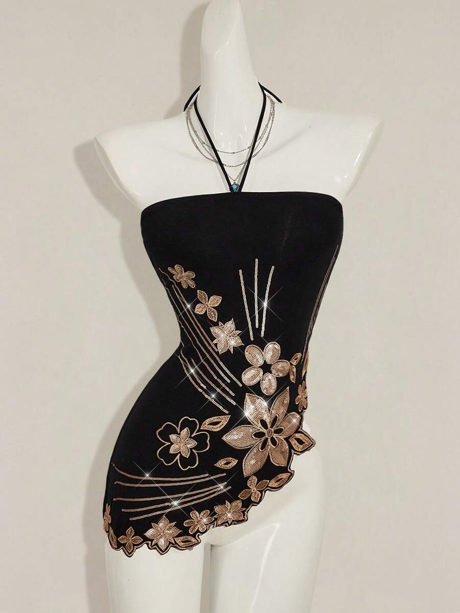 Women's black asymmetrical knitted halter top featuring a slim fit and colorblock pattern