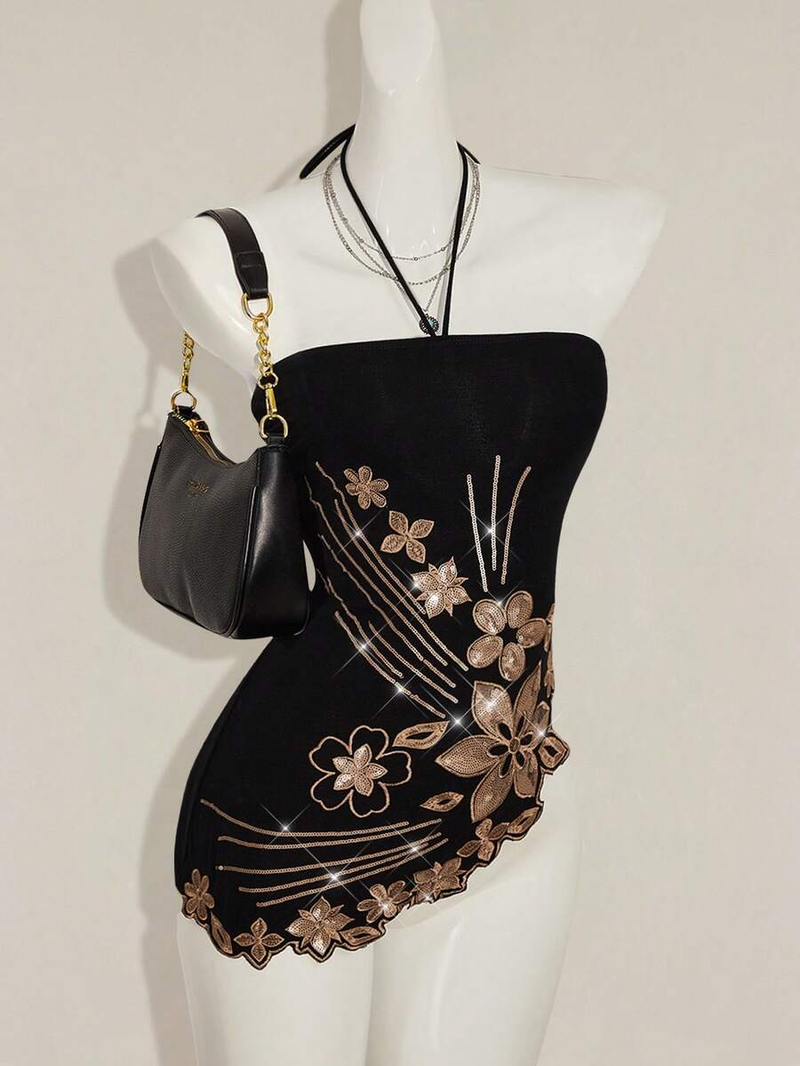 Women's black asymmetrical knitted halter top featuring a slim fit and colorblock pattern