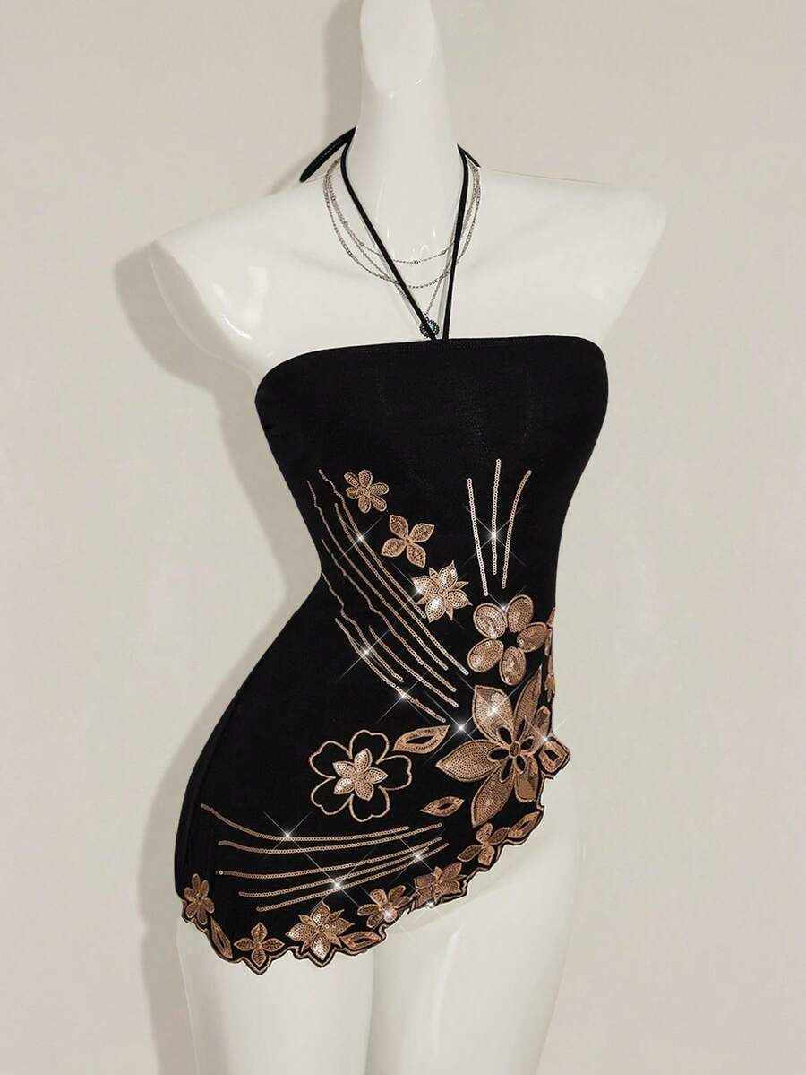 Women's black asymmetrical knitted halter top featuring a slim fit and colorblock pattern