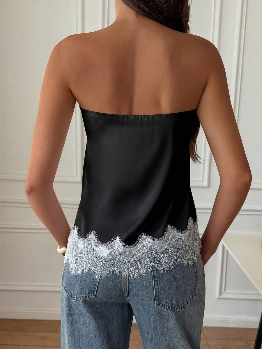 Strapless black and white bandeau top featuring a contrast lace patchwork flared hem and plant pattern.