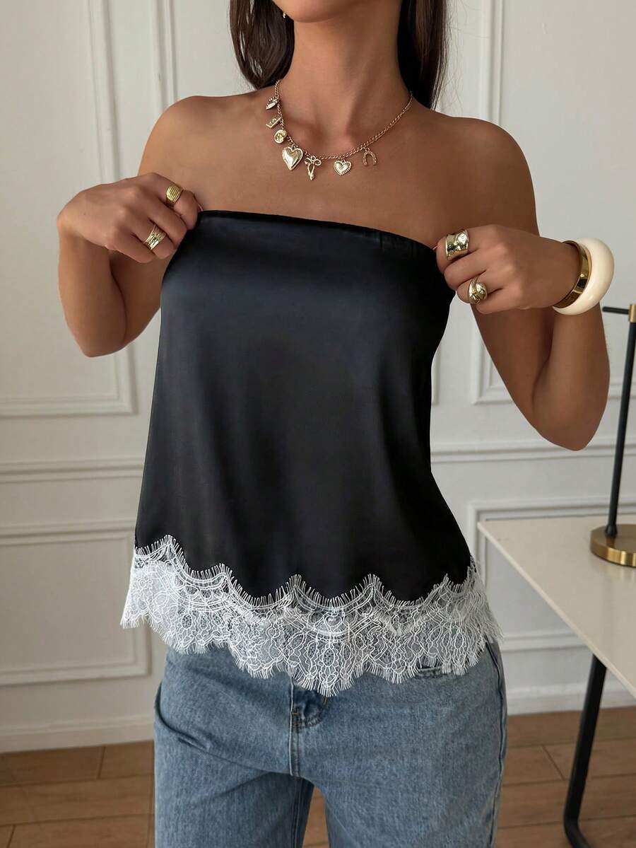 Strapless black and white bandeau top featuring a contrast lace patchwork flared hem and plant pattern.