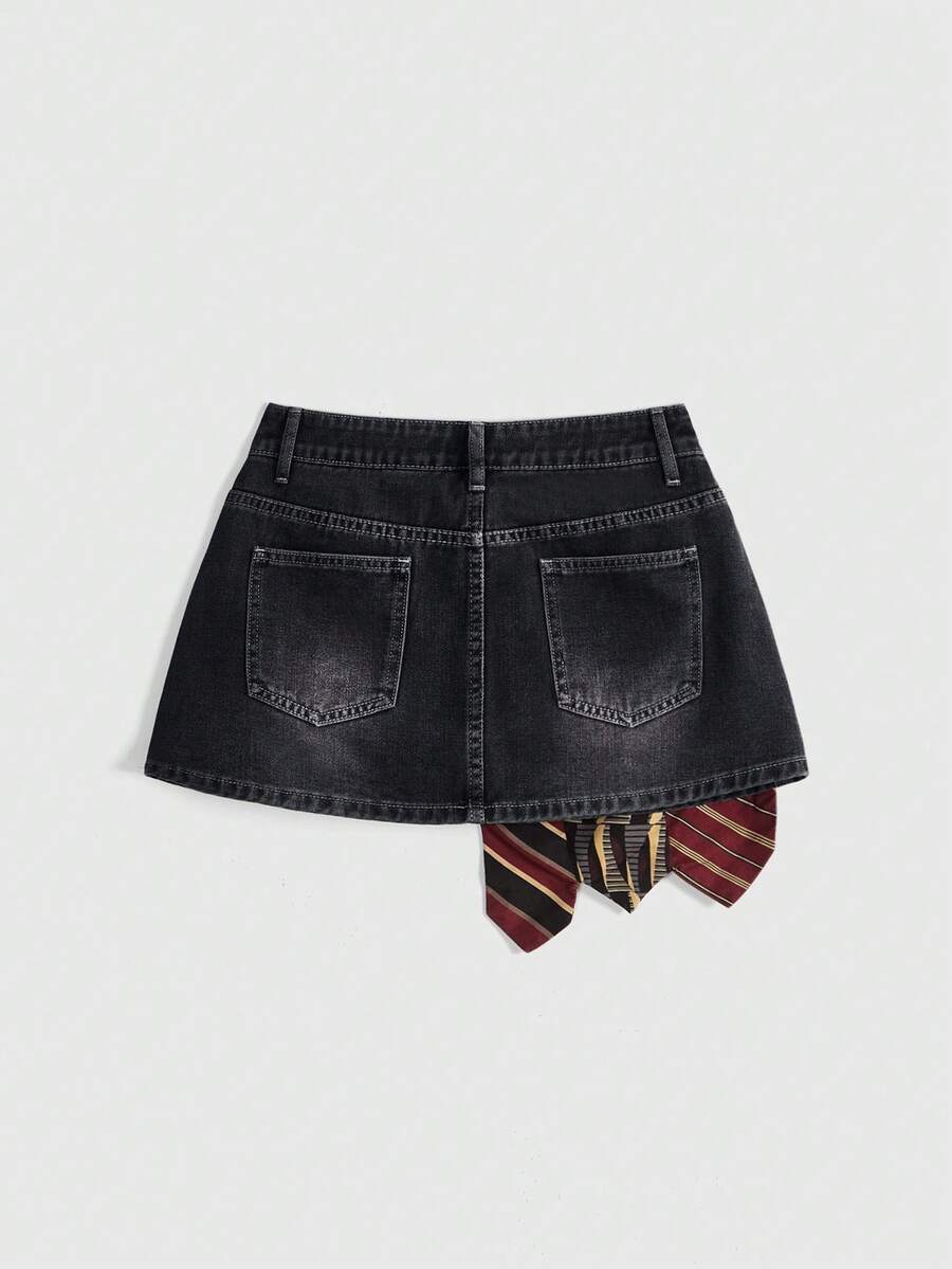 Women's low-waist asymmetrical mini skort featuring button, zipper, and pocket details in an A-line cut.