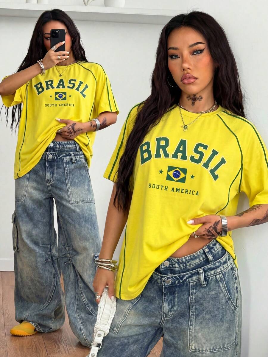 Yellow oversized graphic t-shirt featuring Brazil letter print on the front with contrast raglan sleeves and side stripe detailing.