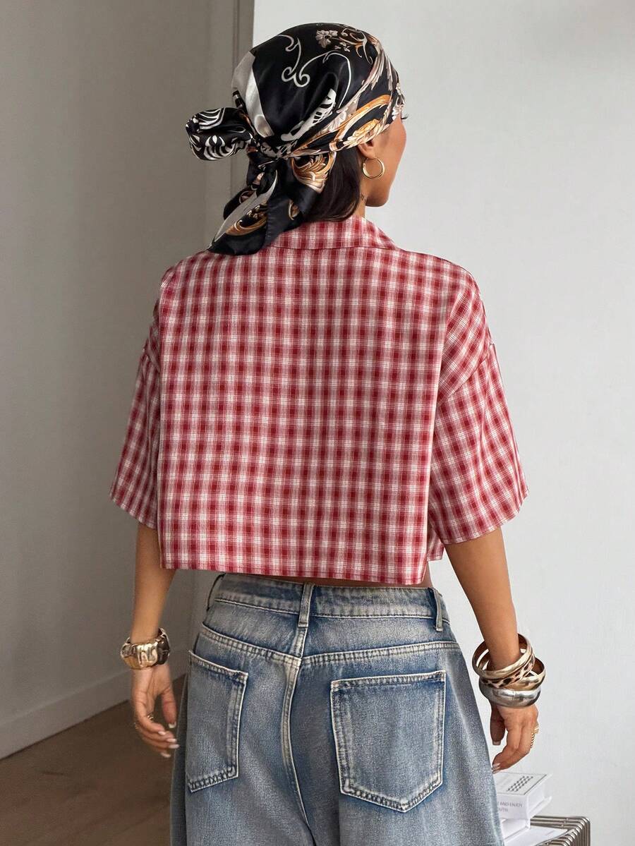 Women's plaid crop shirt with button front, chest pocket, short sleeves, and loose casual fit.