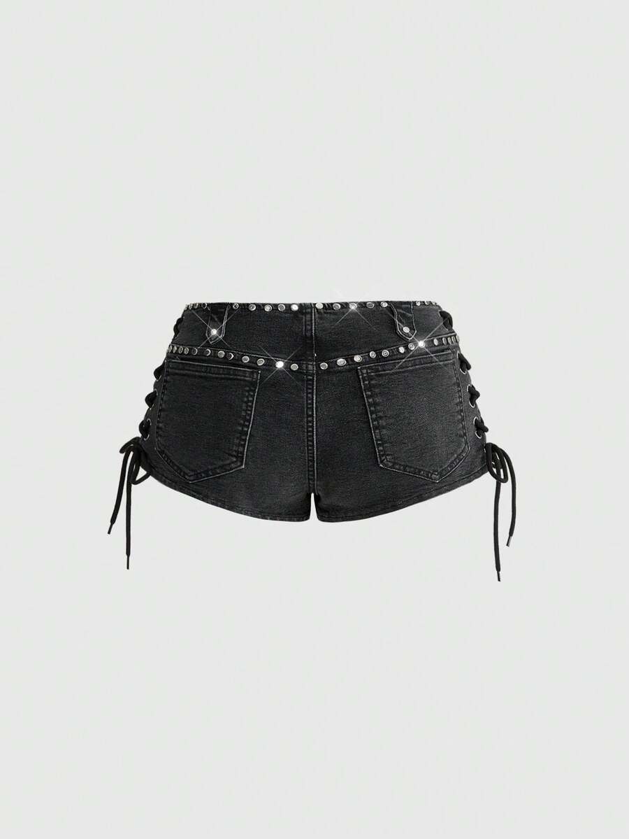 Women's low-rise studded denim mini shorts with a skinny fit and stretch fabric.