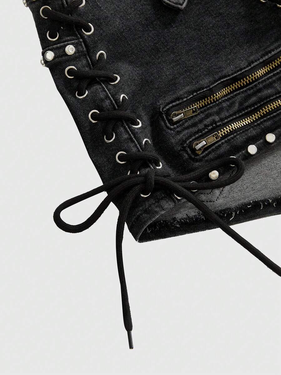 Women's low-rise studded denim mini shorts with a skinny fit and stretch fabric.