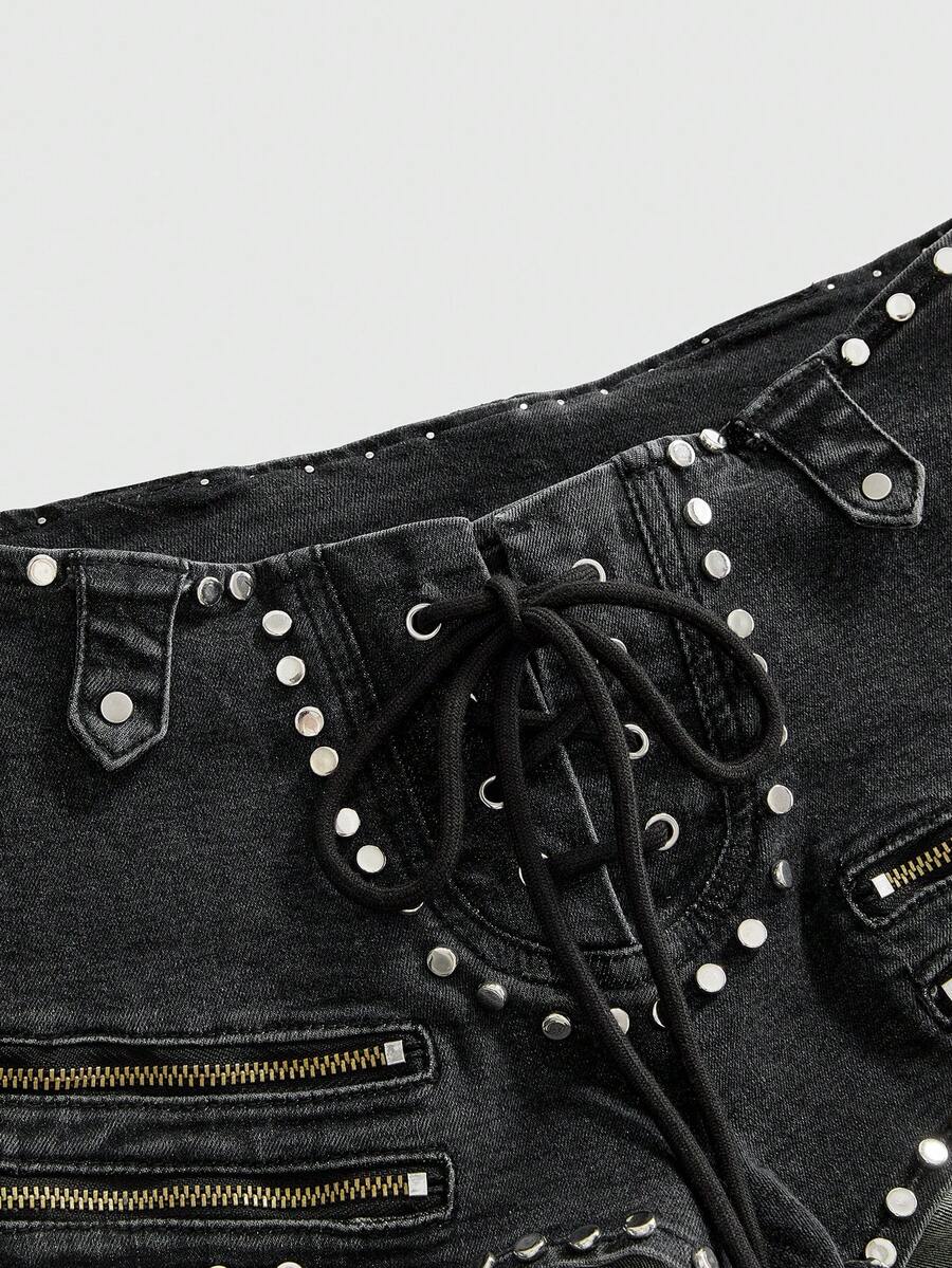 Women's low-rise studded denim mini shorts with a skinny fit and stretch fabric.