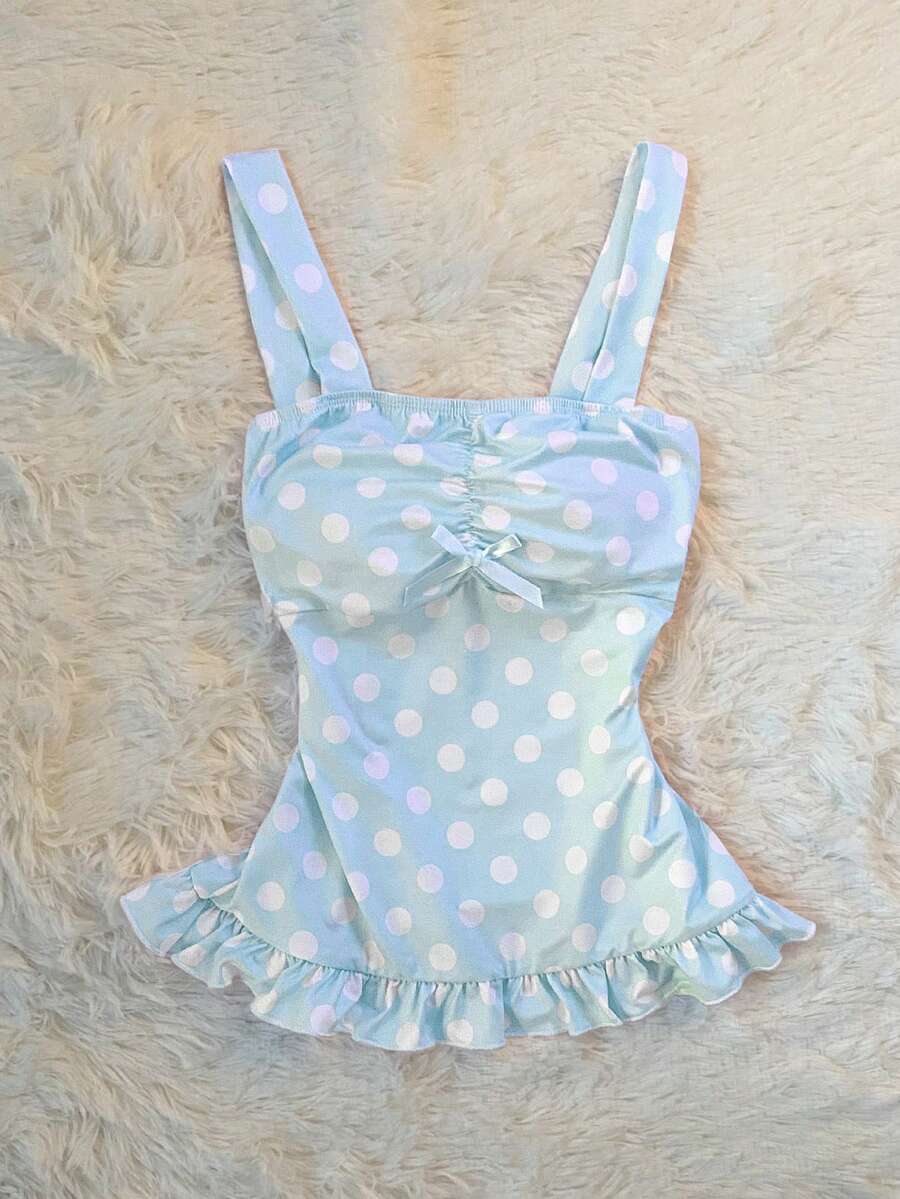 Women's retro slim-fit crop top featuring wide straps, ruched shirred detailing, asymmetrical ruffle hem, and cute bow accent.