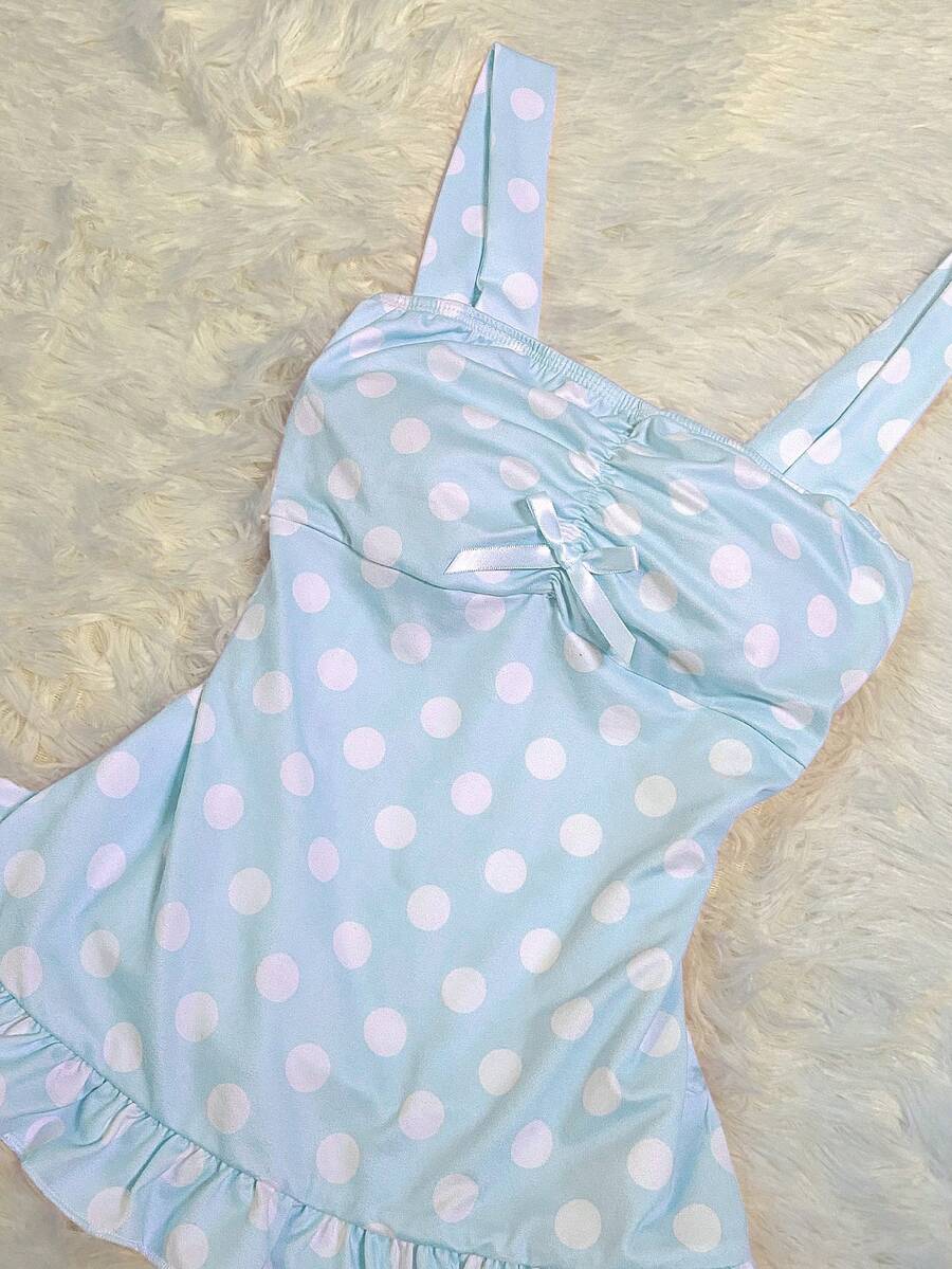 Women's retro slim-fit crop top featuring wide straps, ruched shirred detailing, asymmetrical ruffle hem, and cute bow accent.