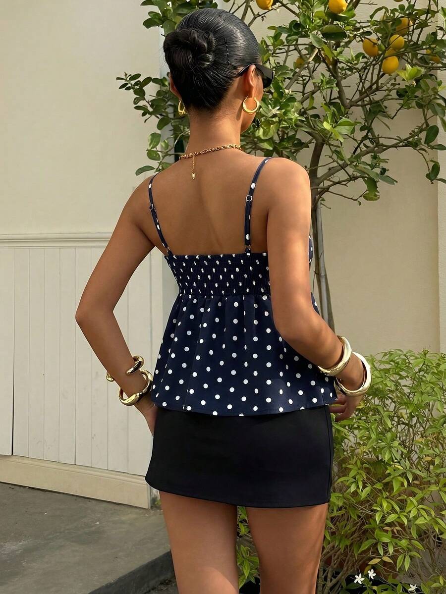Women's casual geometric cami top with spaghetti straps, backless wrap styling, button front, and asymmetrical hem.