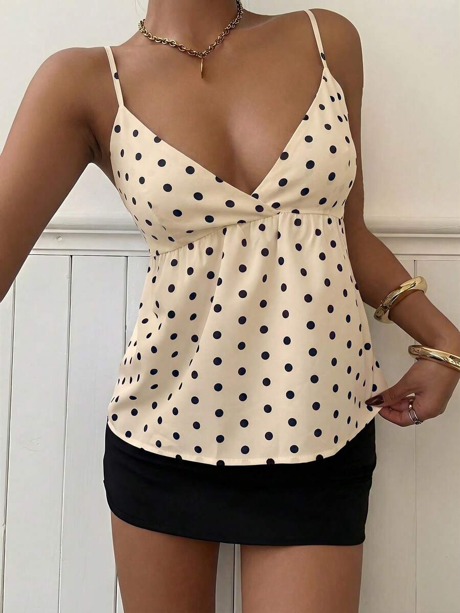 Women's casual geometric cami top with spaghetti straps, backless wrap styling, button front, and asymmetrical hem.