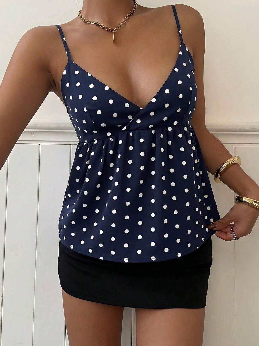 Women's casual geometric cami top with spaghetti straps, backless wrap styling, button front, and asymmetrical hem.