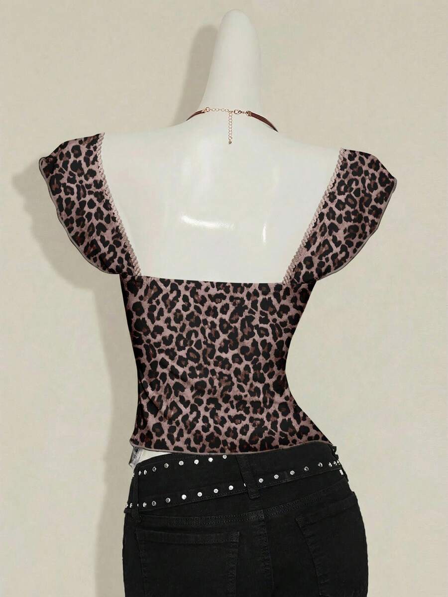 Black slim fit women's ruched front camisole tank top featuring contrast mesh inserts, square neckline, and an asymmetrical crop hem.