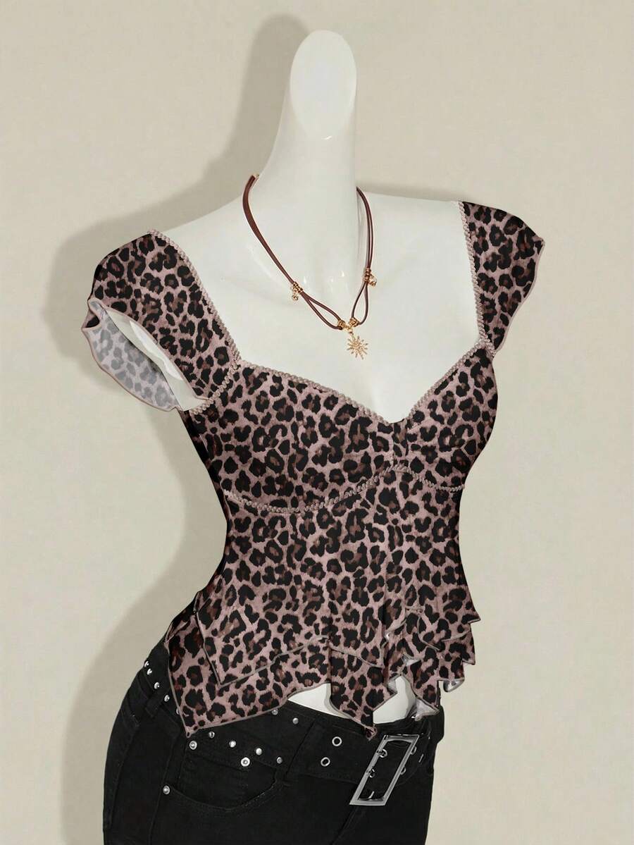 Black slim fit women's ruched front camisole tank top featuring contrast mesh inserts, square neckline, and an asymmetrical crop hem.
