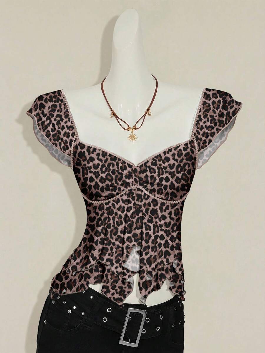 Black slim fit women's ruched front camisole tank top featuring contrast mesh inserts, square neckline, and an asymmetrical crop hem.