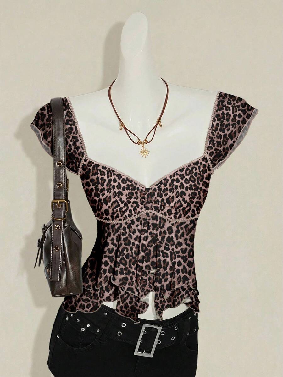 Black slim fit women's ruched front camisole tank top featuring contrast mesh inserts, square neckline, and an asymmetrical crop hem.